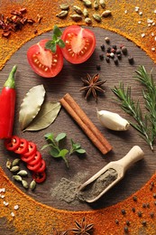 Silhouette of plate made with spices and different ingredients on wooden table, flat lay