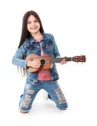 Photo of Little cheerful girl playing guitar, isolated on white