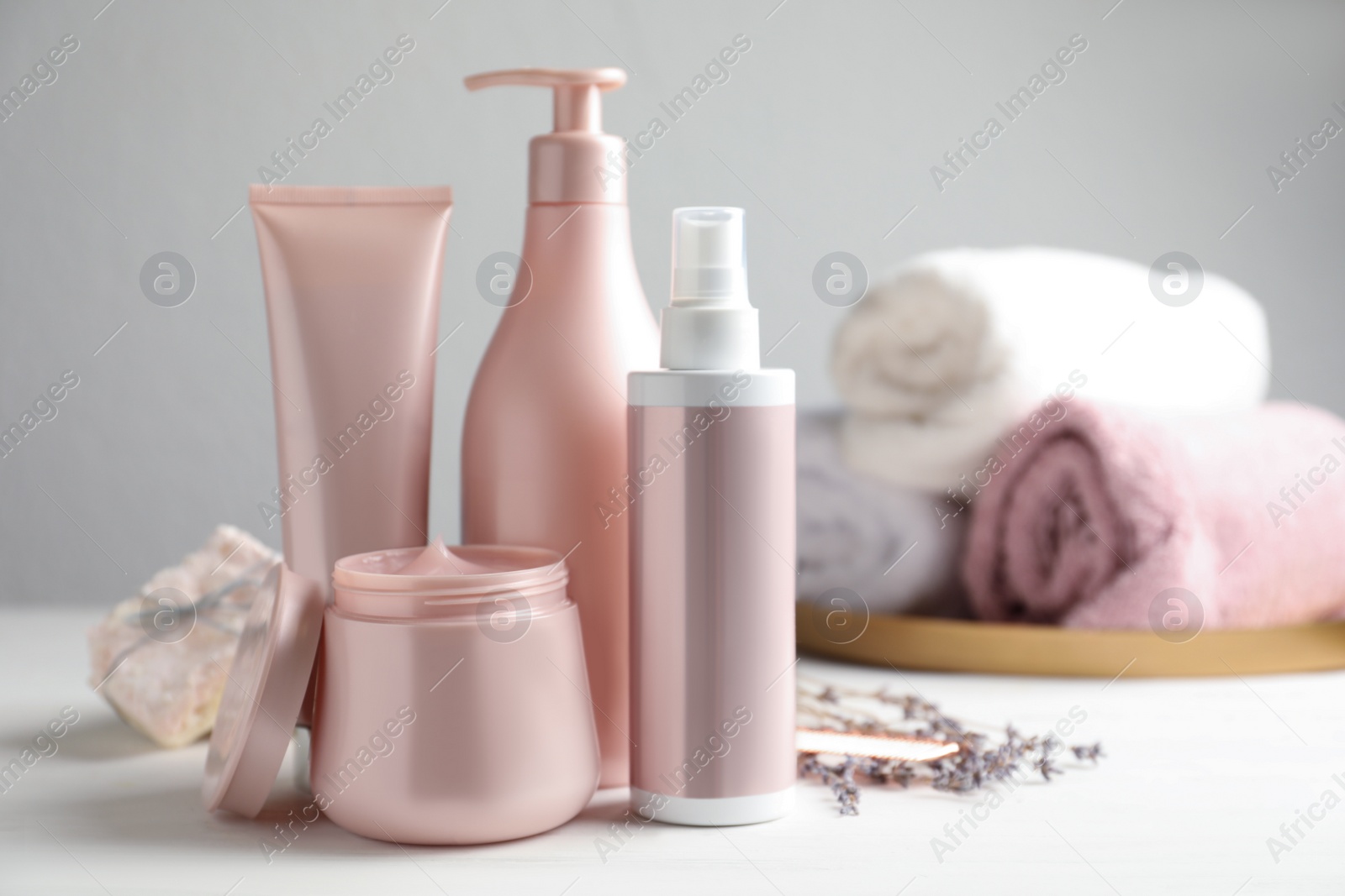 Photo of Set of hair care cosmetic products on white table. Space for text