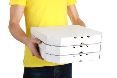 Young man with pizza boxes on white background. Food delivery service