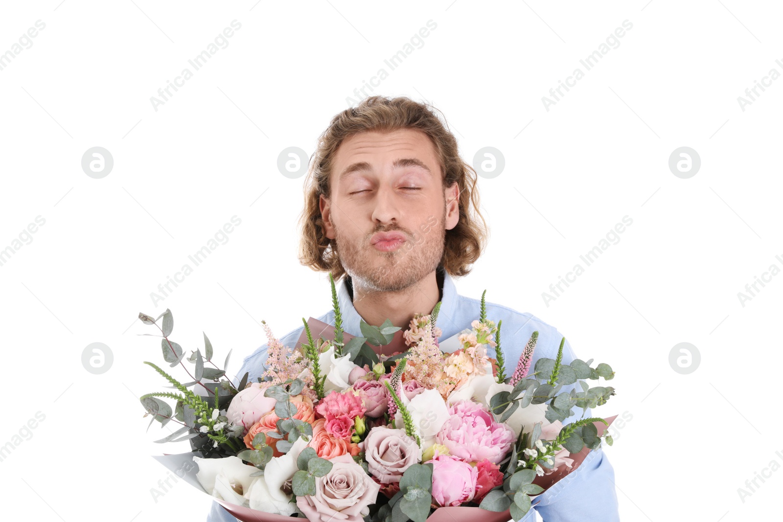 Photo of Young handsome man with beautiful flower bouquet on white background