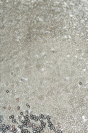 Photo of Fabric with beautiful shiny paillettes as background