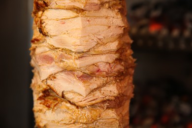 Photo of Vertical rotisserie with roasted meat, closeup view