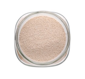Photo of Jar with active dry yeast isolated on white, top view