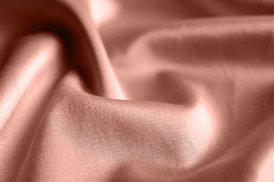 Image of Textured rose gold fabric as background, closeup view