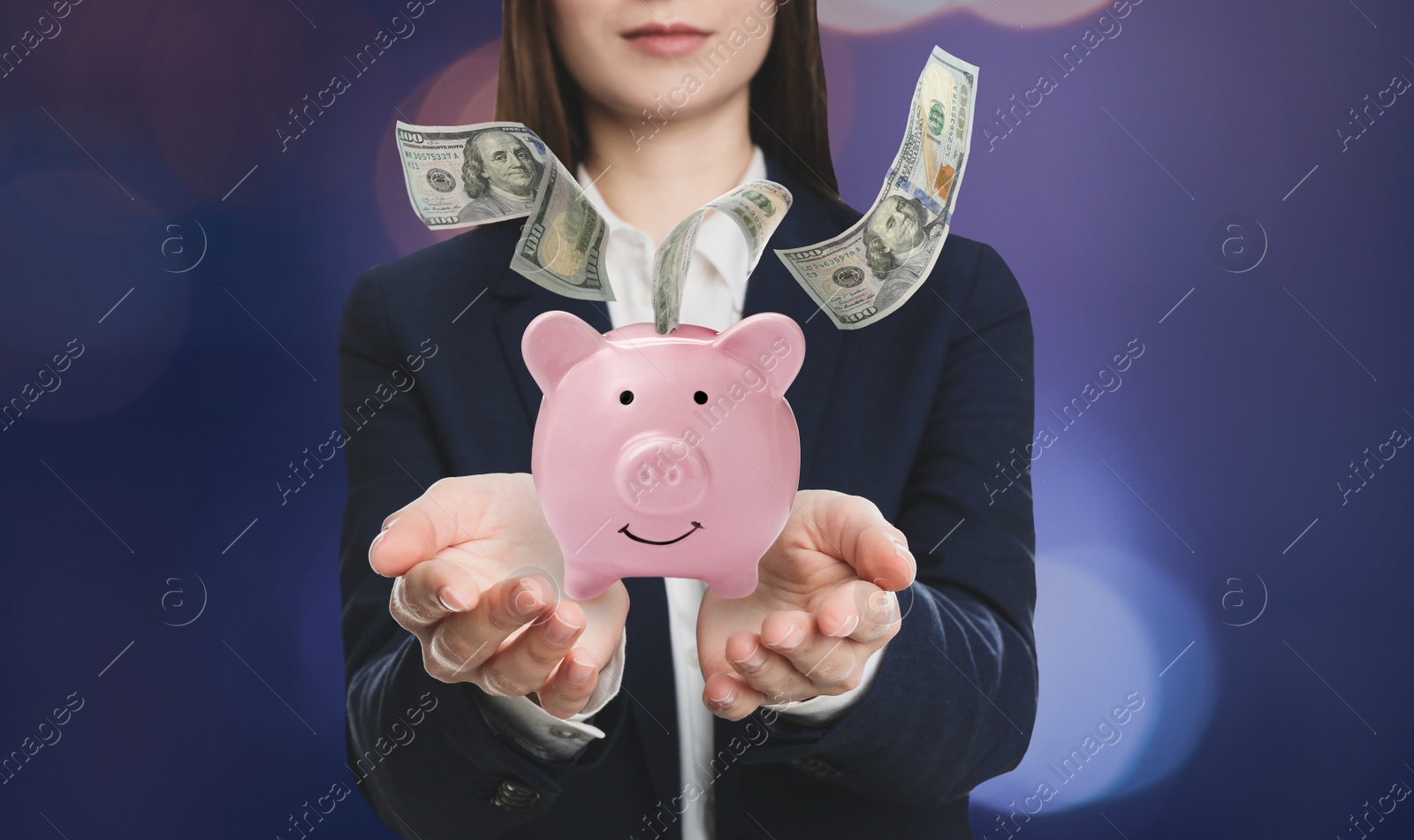 Image of Young woman holding piggy bank and American dollars falling on color background, closeup 