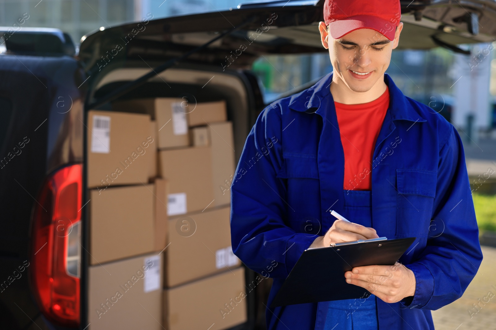 Photo of Courier with clipboard near delivery van outdoors, space for text