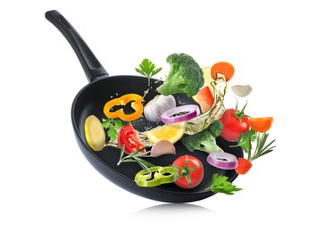 Tasty fresh ingredients and frying pan on white background