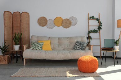 Photo of Beautiful living room interior with stylish beige sofa