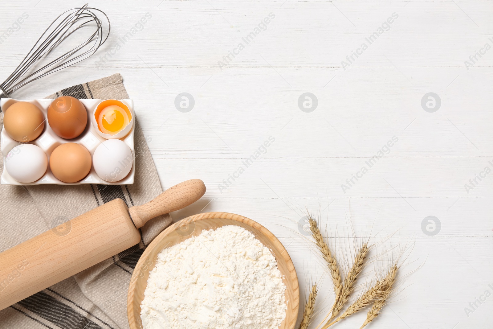 Photo of Flat lay composition with dough ingredients on white wooden table. Space for text