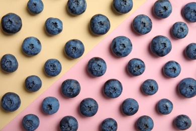 Flat lay composition with tasty blueberry on color background