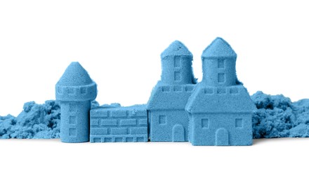 Photo of Castle made of blue kinetic sand isolated on white