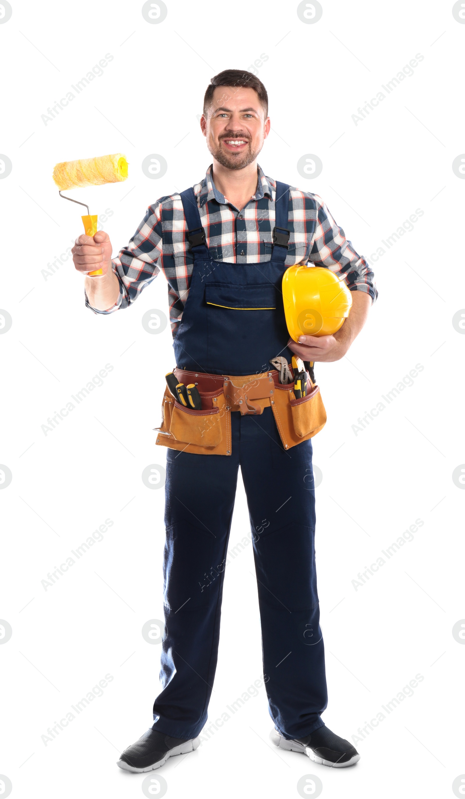 Photo of Full length portrait of professional construction worker with hard hat, paint roller and tool belt on white background