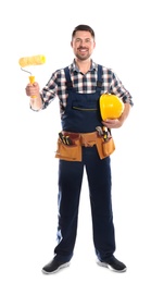 Photo of Full length portrait of professional construction worker with hard hat, paint roller and tool belt on white background