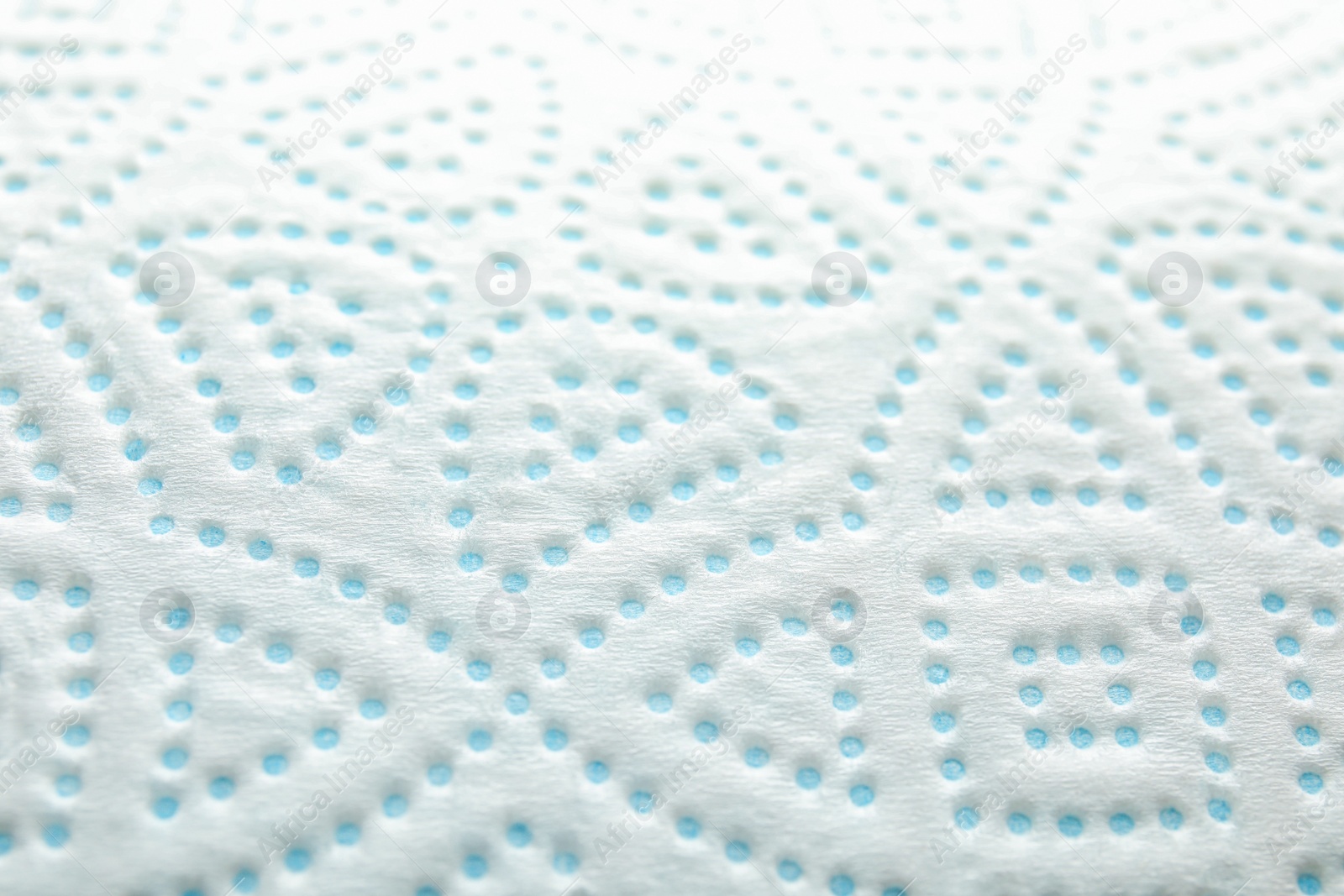 Photo of Toilet paper with pattern as background, closeup