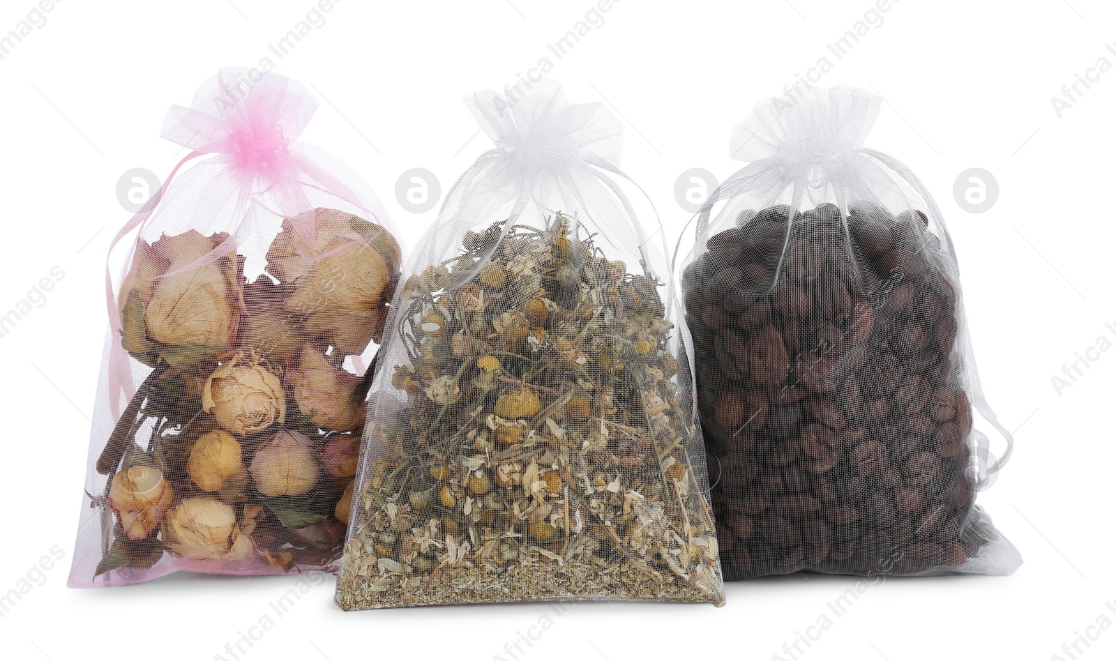Photo of Scented sachets with dried roses, chamomile flowers and coffee beans isolated on white