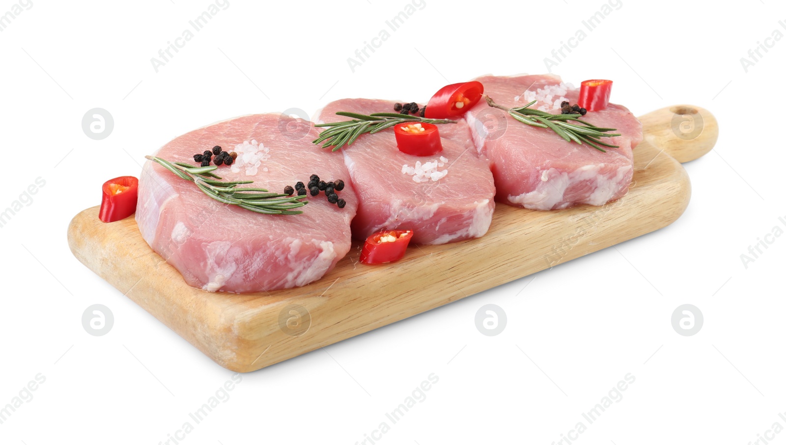 Photo of Wooden board with pieces of raw pork meat and spices isolated on white