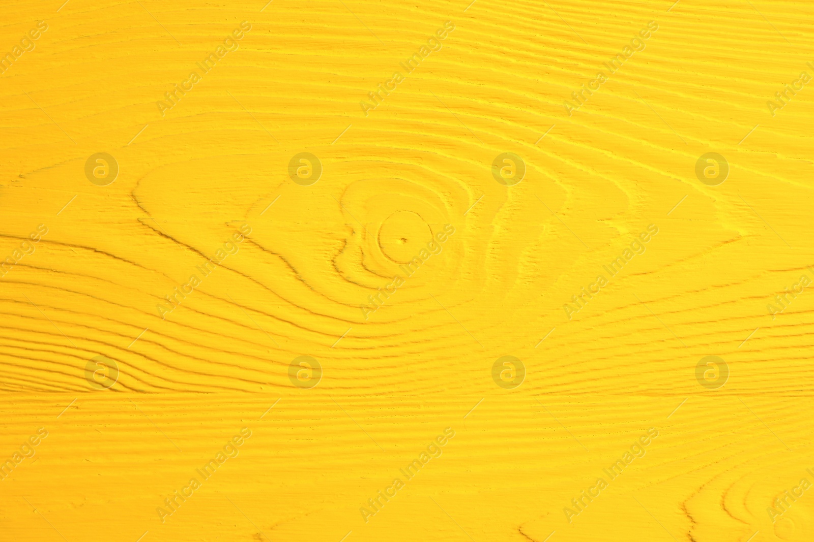 Photo of Texture of yellow wooden surface as background, closeup