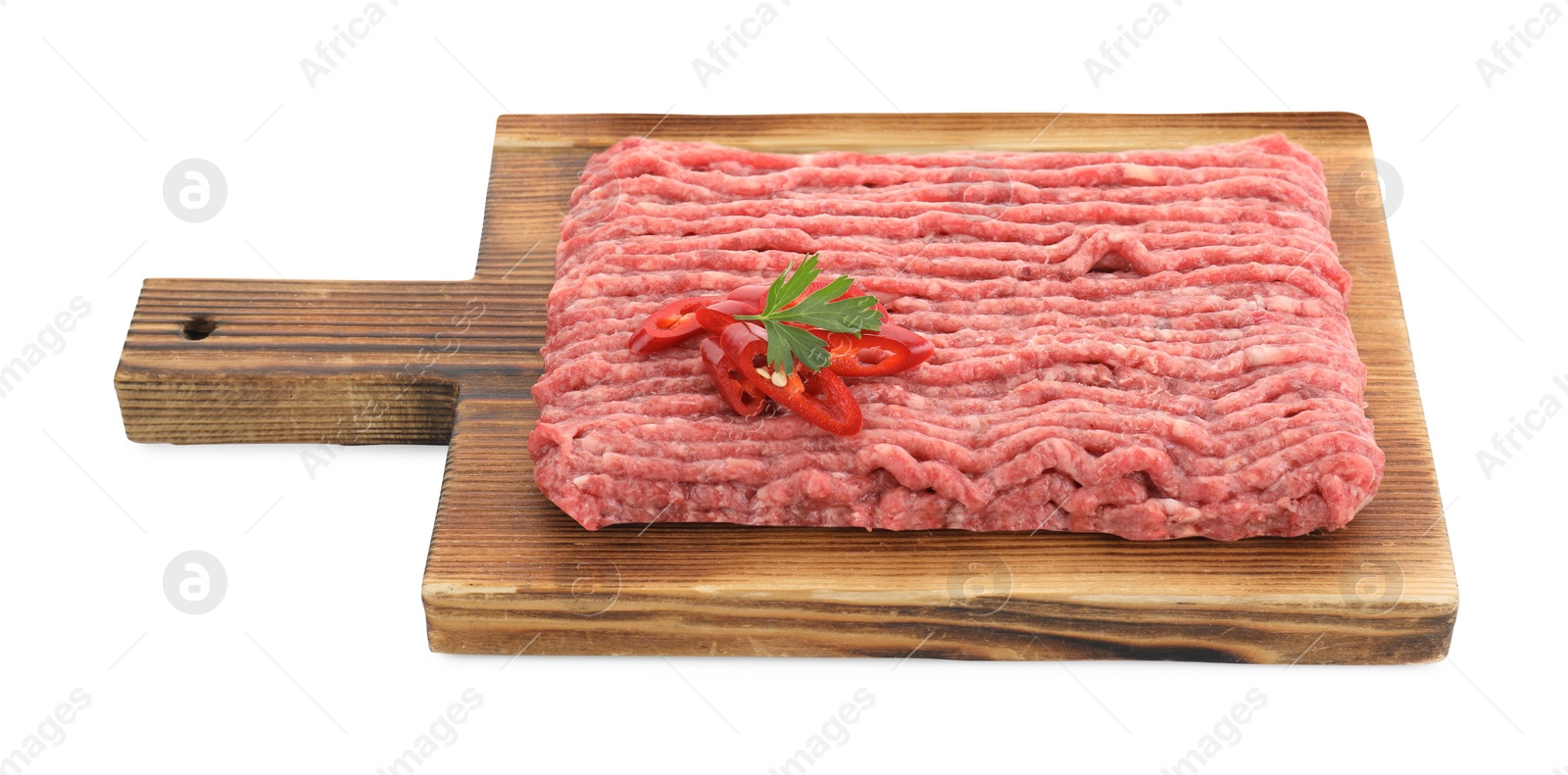 Photo of Board with raw ground meat, chili pepper and parsley isolated on white