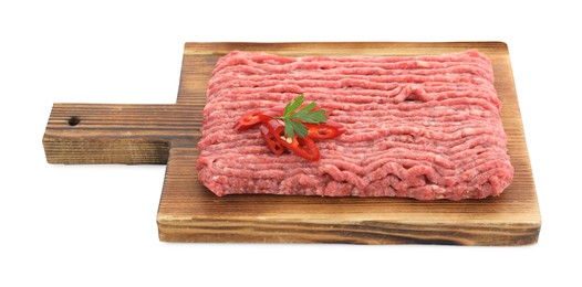 Board with raw ground meat, chili pepper and parsley isolated on white