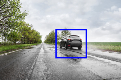 Image of Wet suburban road with scanner frame on car outdoors. Machine learning