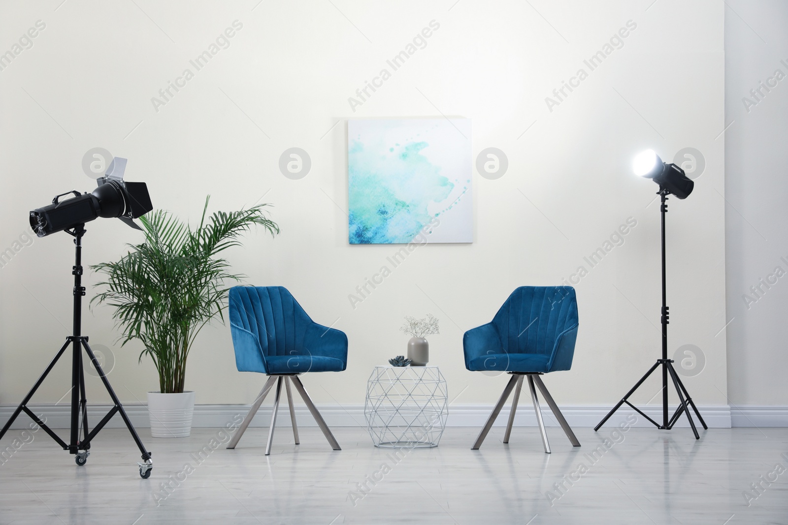 Photo of Professional photo studio equipment prepared for shooting living room interior