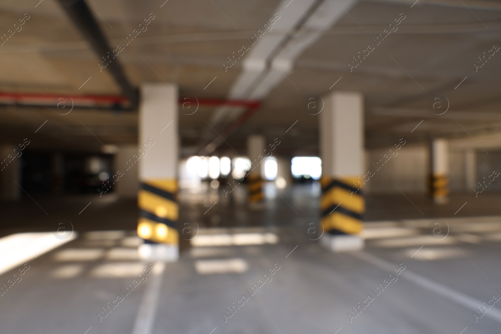 Photo of Blurred view of modern car parking garage