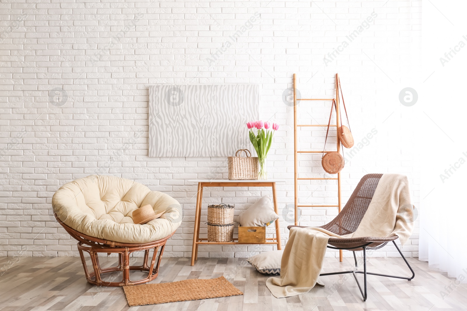 Photo of Stylish living room interior with cozy armchairs near brick wall