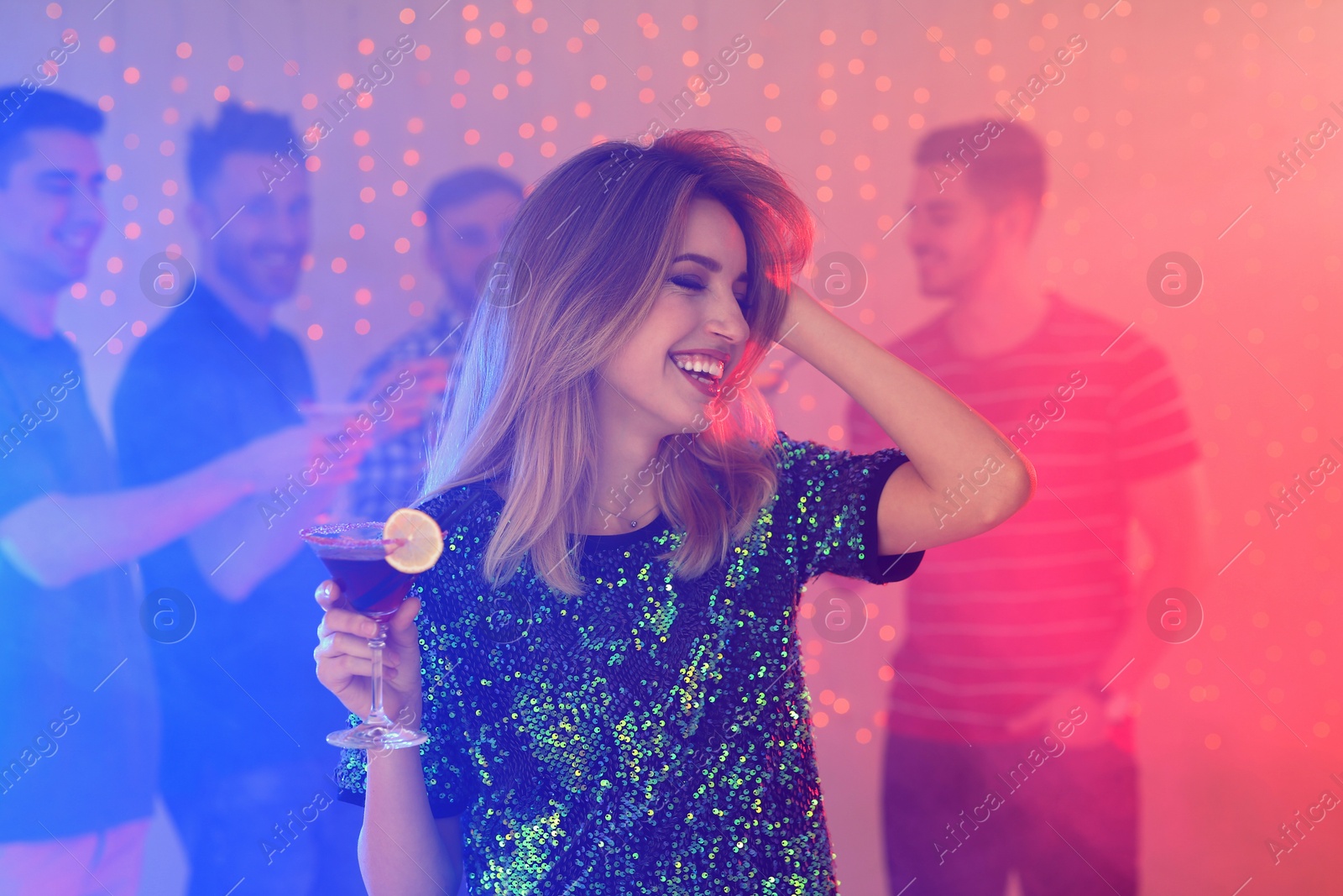 Photo of Beautiful young woman with glass of martini cocktail in bar