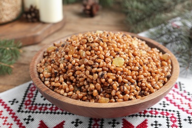 Photo of Traditional Christmas slavic dish kutia served on  table, closeup