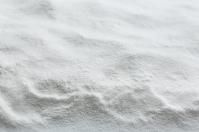 Photo of Pure baking soda as background, closeup view
