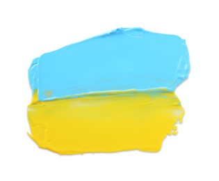 Photo of Light blue and yellow paint samples on white background, top view