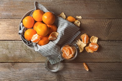 Many fresh ripe tangerines on wooden table, flat lay