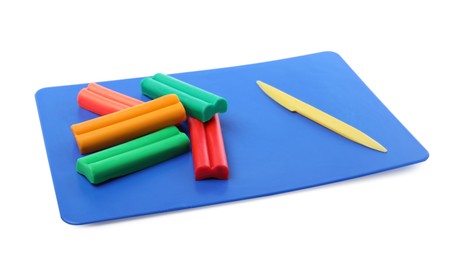 Photo of Many different colorful plasticine pieces and sculpting knife on white background