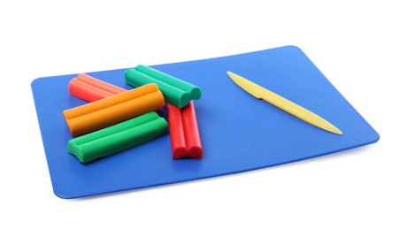 Many different colorful plasticine pieces and sculpting knife on white background