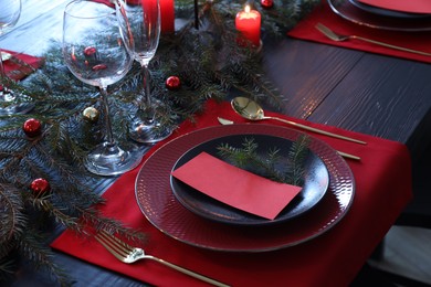 Elegant Christmas table setting with blank place card and festive decor