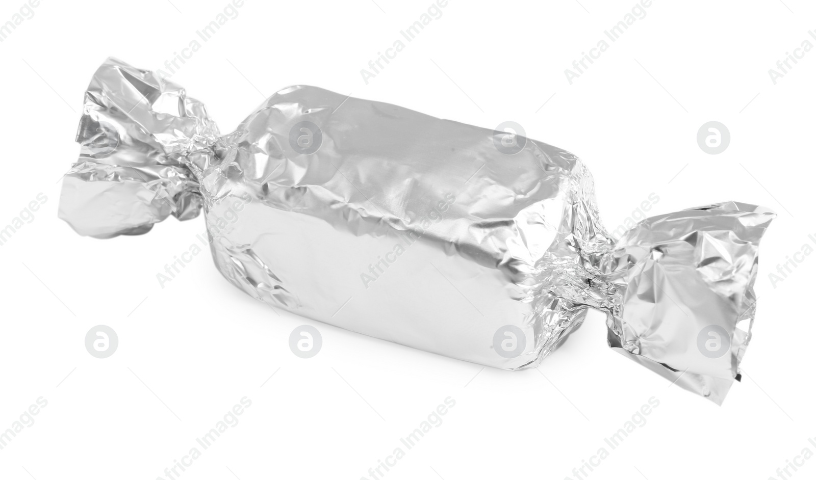 Photo of Tasty candy in silver wrapper isolated on white