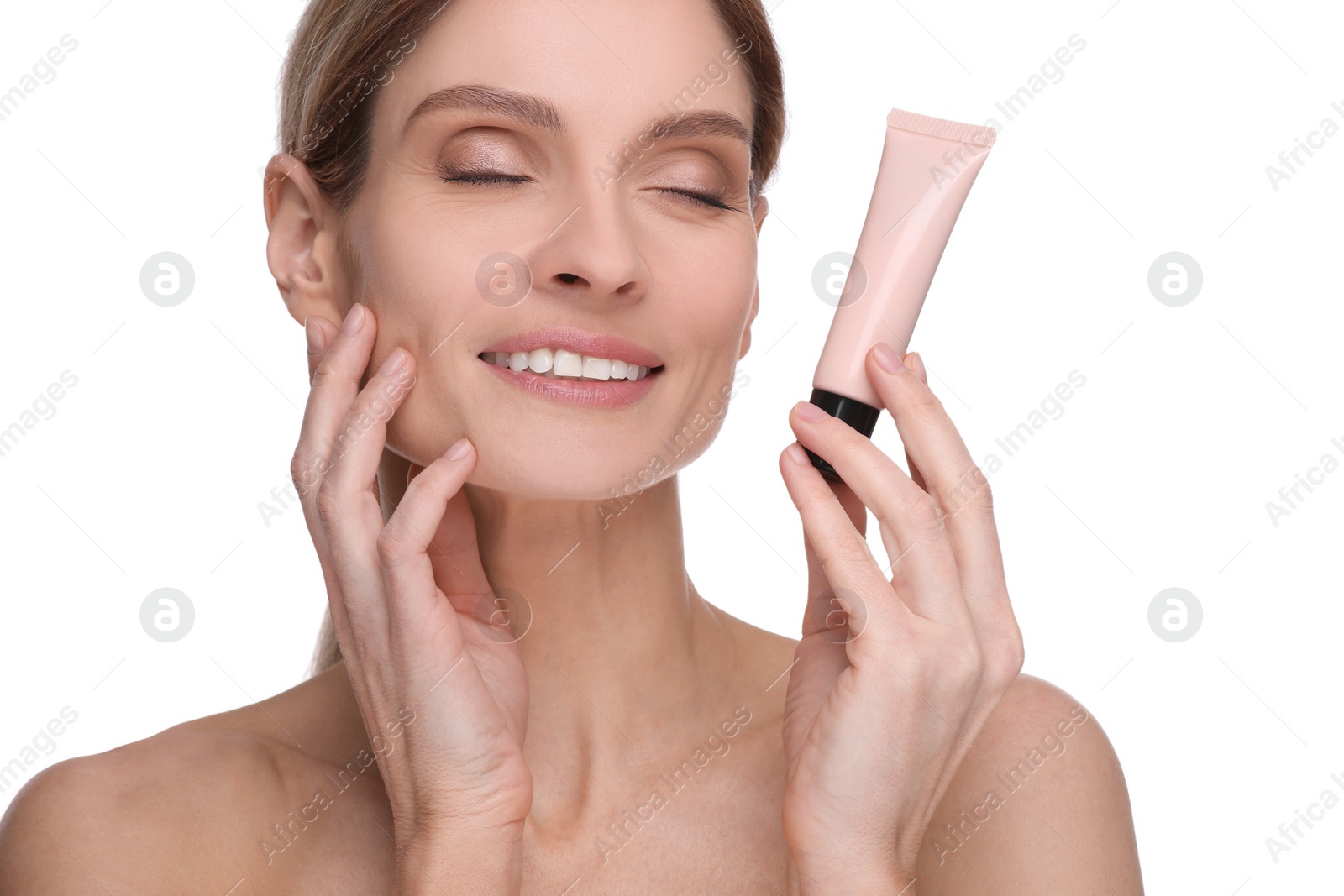 Photo of Woman holding tube with foundation on white background