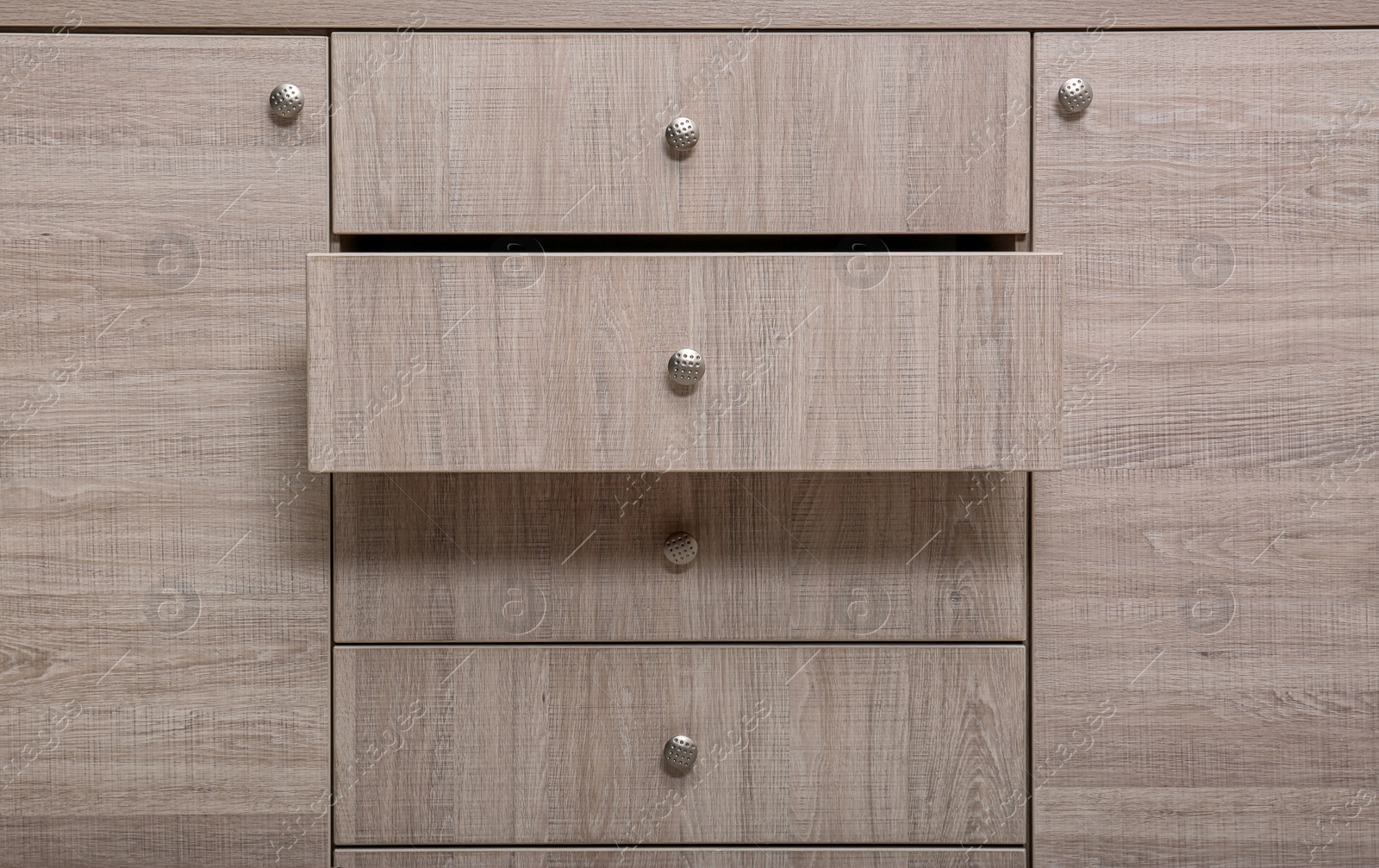 Photo of Wooden wardrobe drawers as background, closeup view