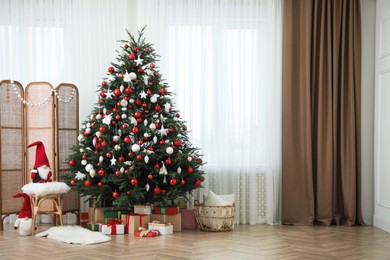 Cozy room interior with Christmas tree, gifts and beautiful festive decor, space for text