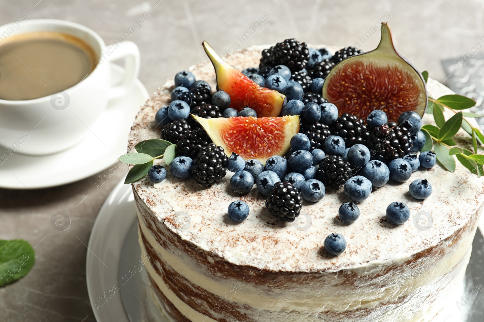 Photo of Delicious homemade cake with fresh berries served on table, closeup