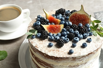 Delicious homemade cake with fresh berries served on table, closeup