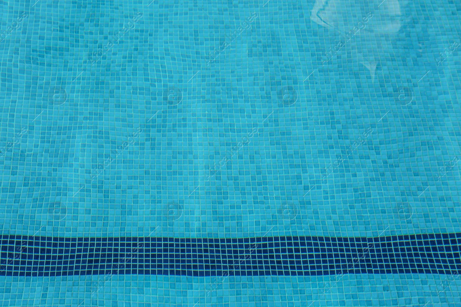 Photo of Empty swimming pool with clear water, above view