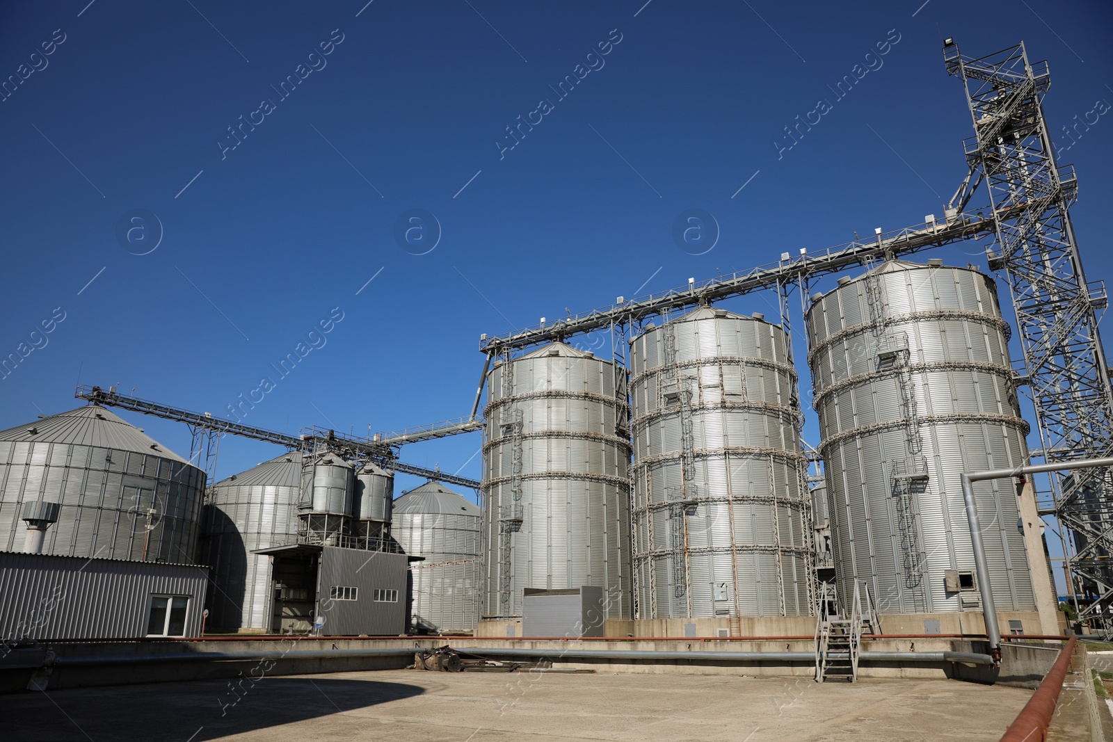 Photo of View of modern granaries for storing cereal grains outdoors