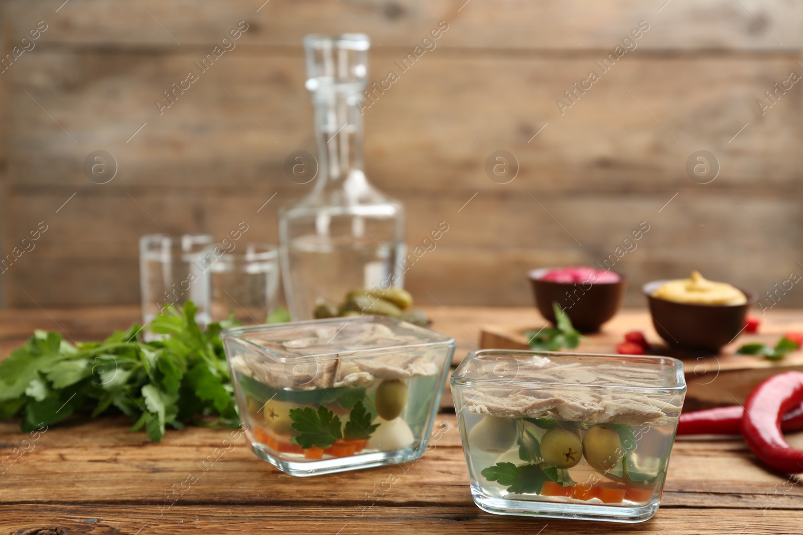 Photo of Delicious aspic with meat on wooden table