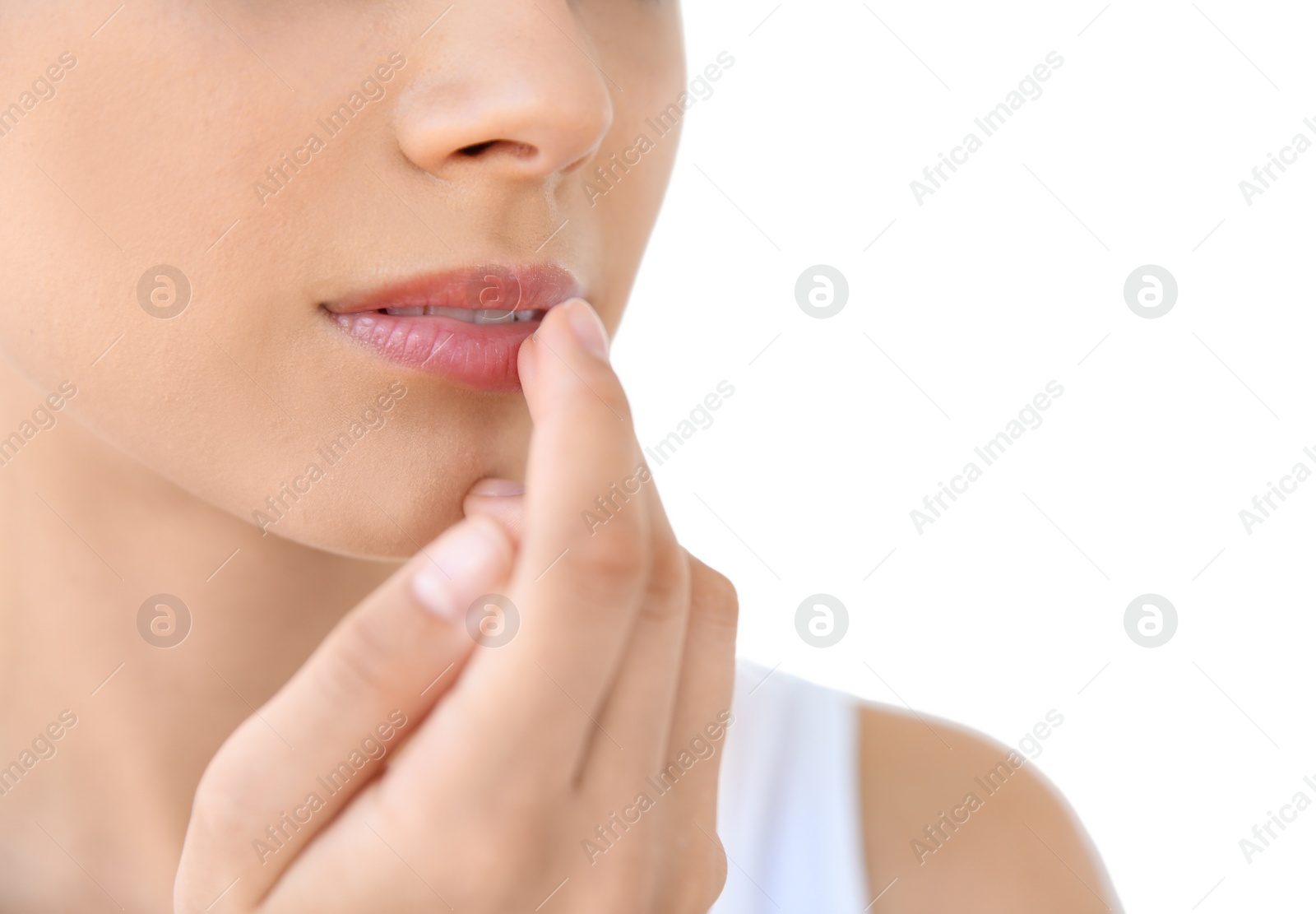 Photo of Young woman with sexy lips on light background, closeup