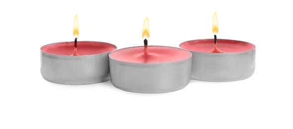 Colorful wax candles on white background. Interior elements