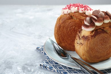 Tasty puff pastry. Crunchy round croissants on light textured table, closeup. Space for text