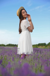 Young woman in lavender field on summer day