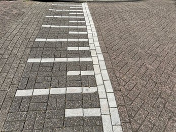 City street with speed bump on sunny day